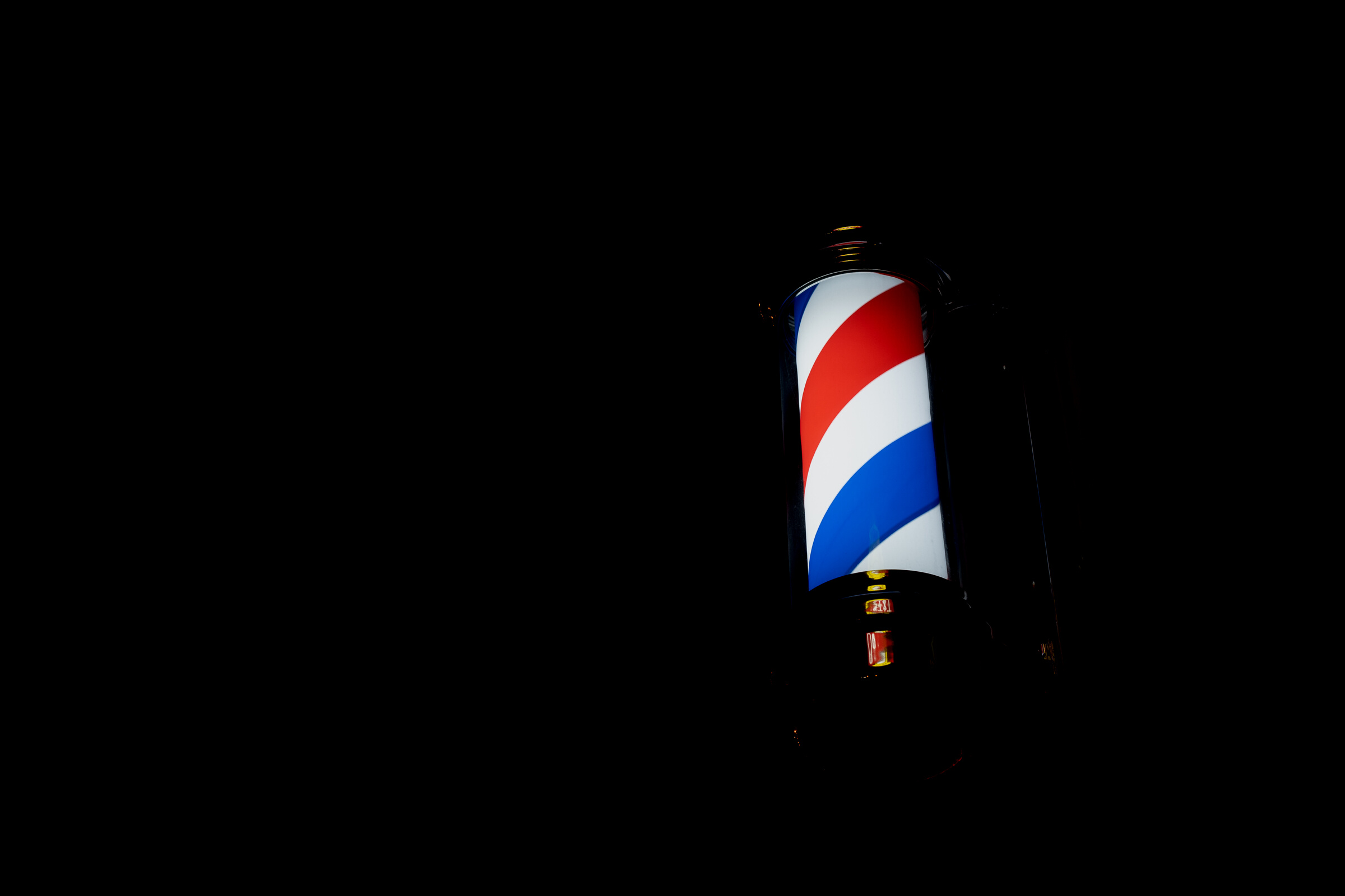 Barber shop pole turning at evening