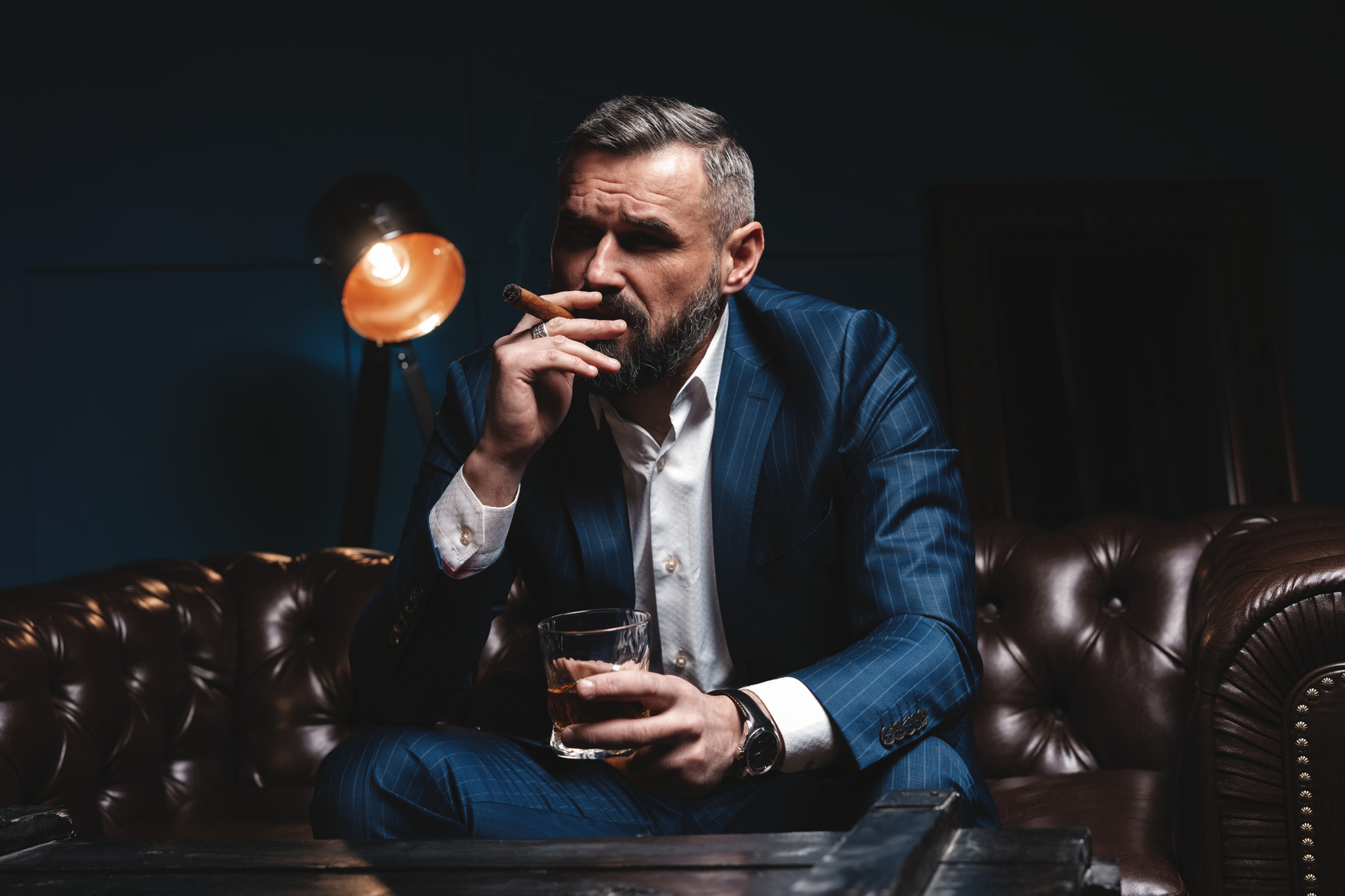 Attractive Man with Cigar and a Glass Whiskey