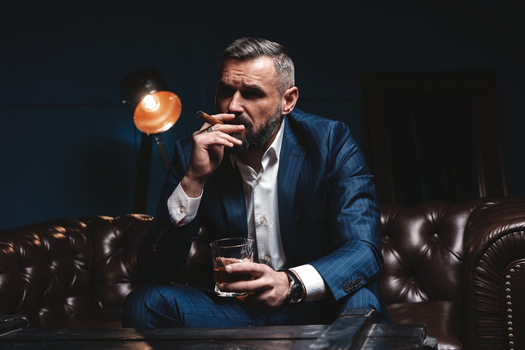 Attractive Man with Cigar and a Glass Whiskey